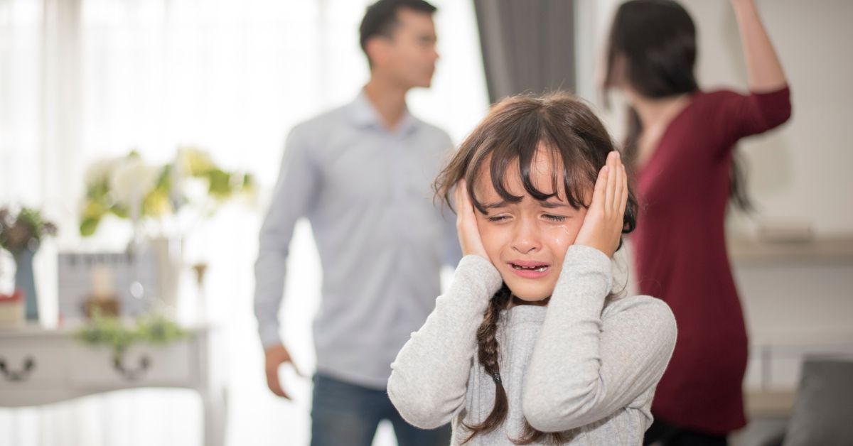 couple fighting in front of child