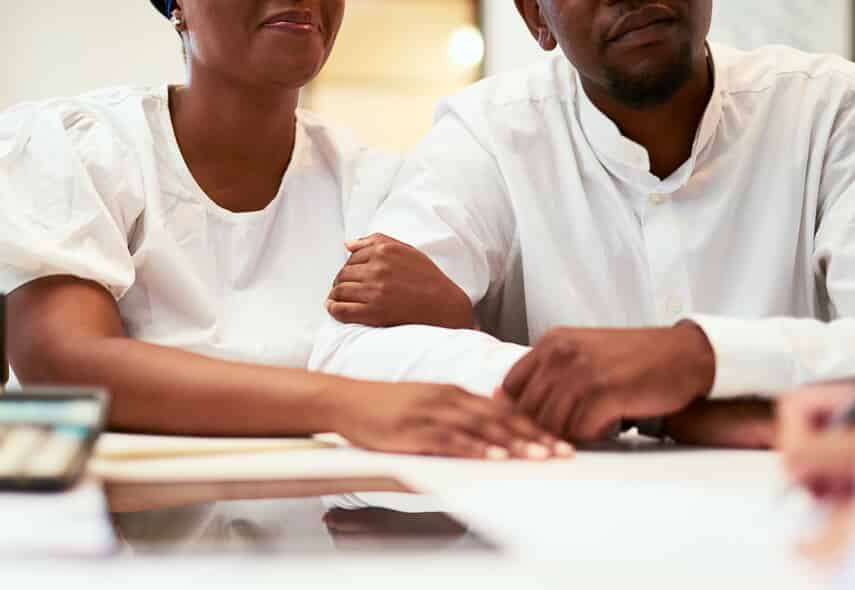 couple meeting with a lawyer for a prenup