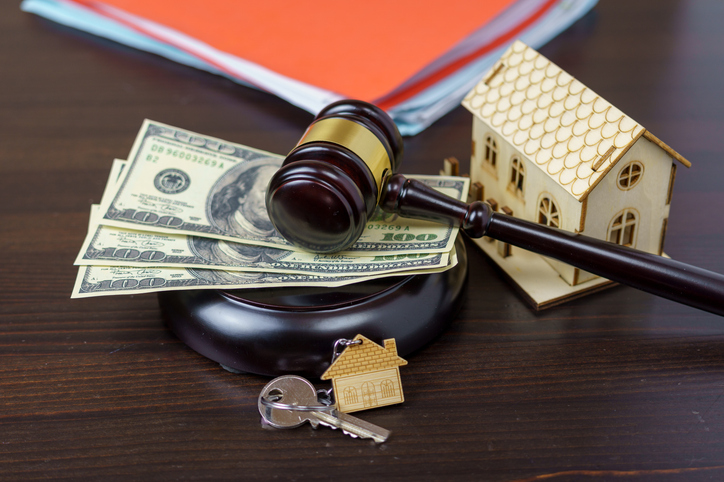 gavel, money, house keys, and house figure