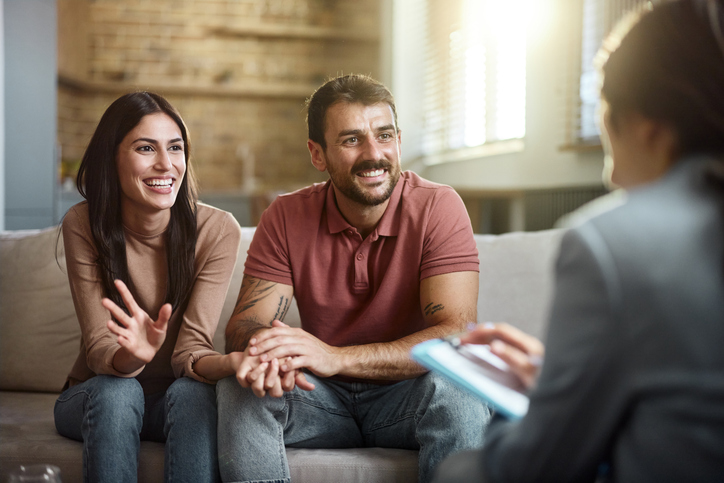 happy couple consulting with a professional