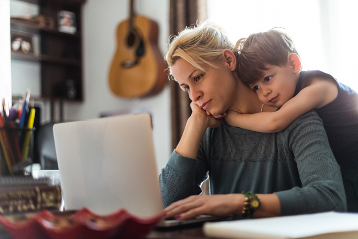 child hugging stressed mother